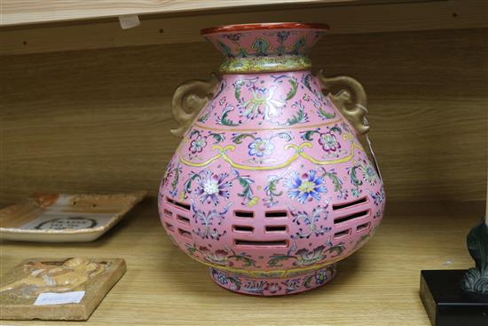 A Chinese pink sgraffito ground double walled vase